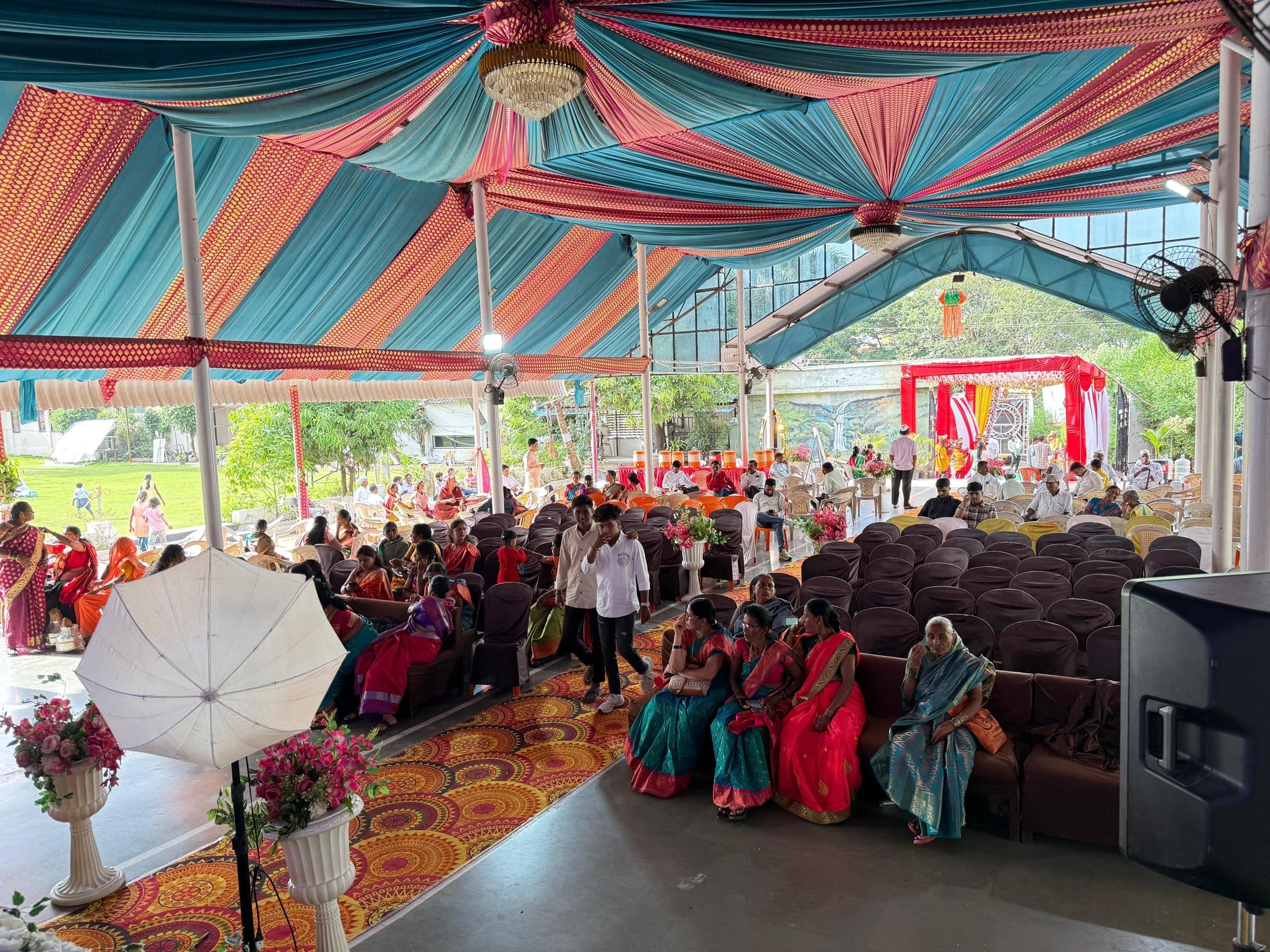 Guests under the canopy for a daytime ceremony